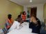 Cristina y Ana acompañan a una familia de afectados en el puesto de filiación de la UME